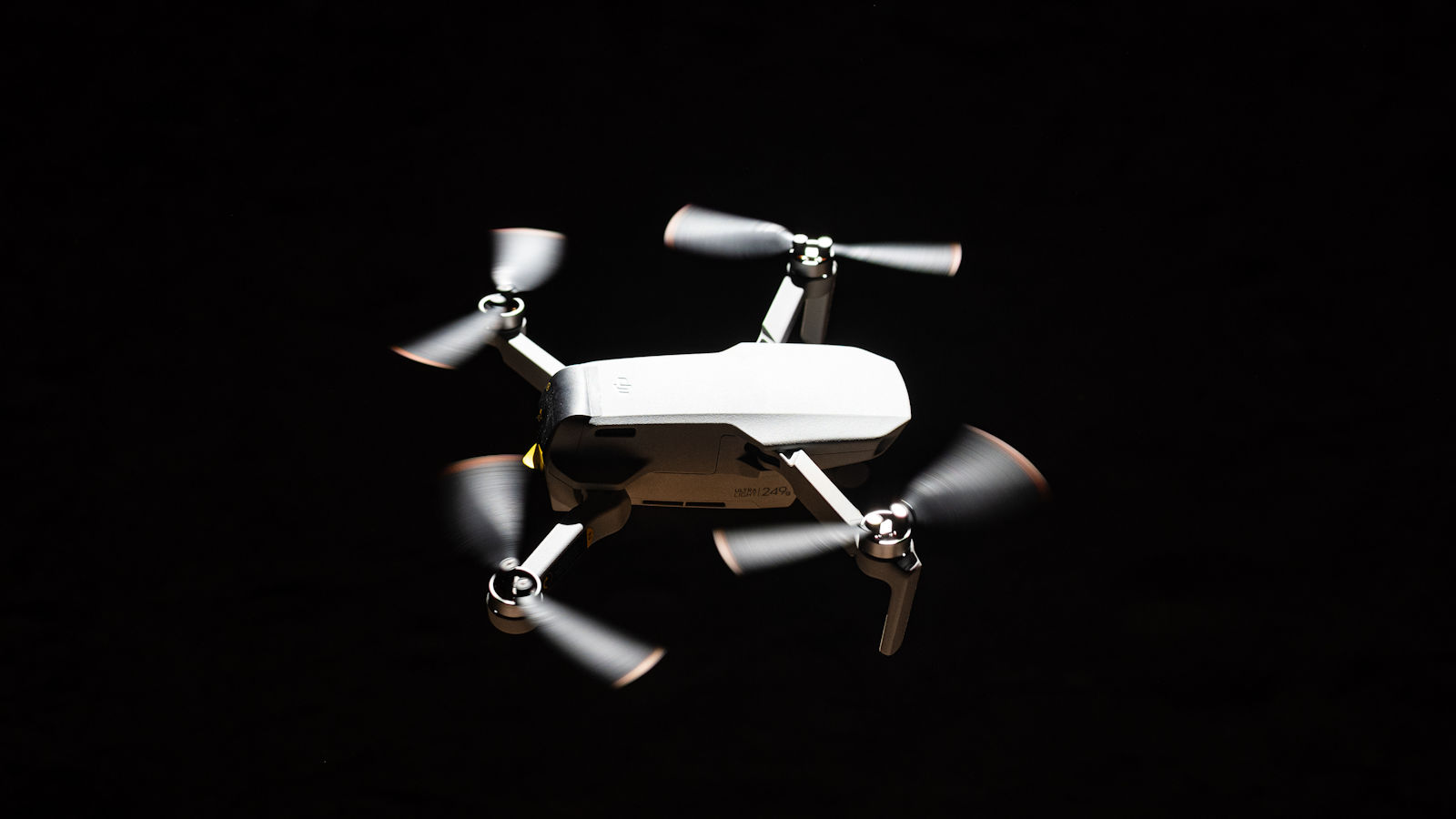 closeup-shot-of-a-flying-drone-on-a-black-backgrou-2023-11-27-04-56-29-utc